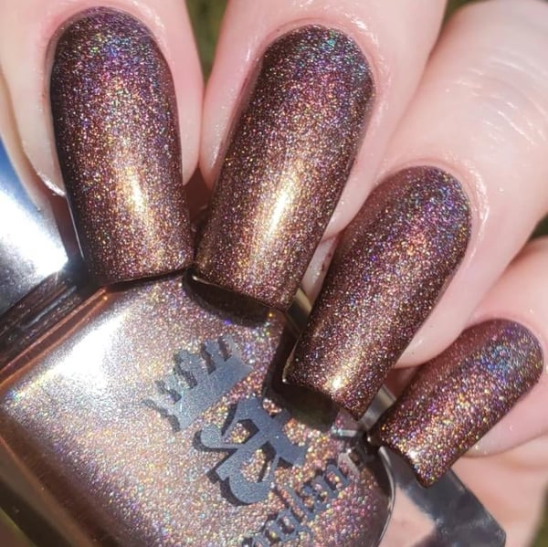 Picture by scratchureyesout saying 'Clytie By A England Polishes A Gorgeous Milk Chocolate Holographic'