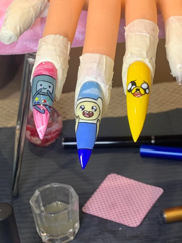 Picture by MelodicCupcake9246 saying 'Adventure Time Nail Art I Did!! Constructive Criticism Welcome, Always Trying To Get Better :'