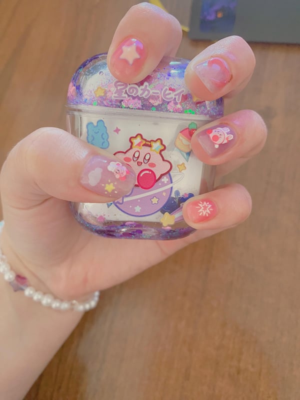 Picture by woofdis saying 'Kirby Nails'