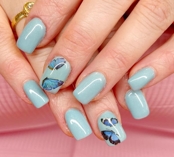 Picture by nailmama92397 saying 'Blue Butterflies For My Lovely Client.'