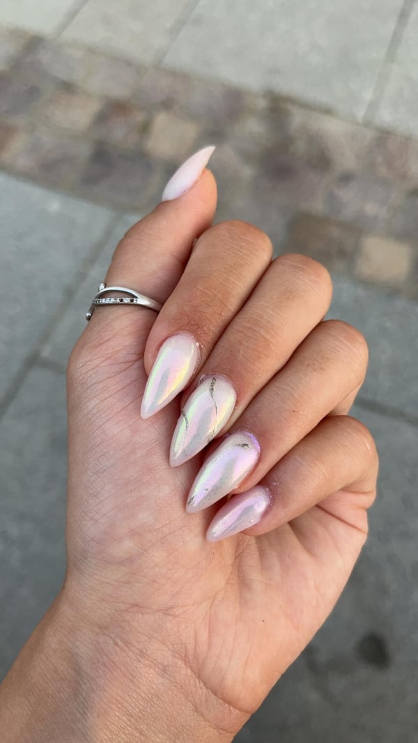 Picture by asi9434 saying 'Chrome Nails This Month🤍💅'