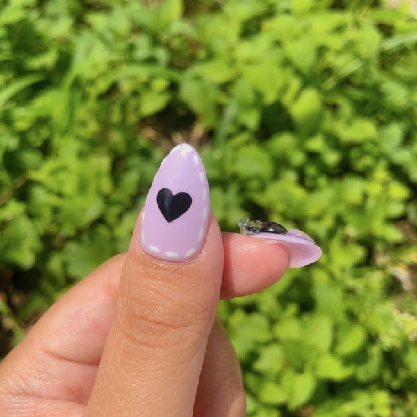 Picture by xXx_Lavender_xXx saying 'Kuromi Nails 💜'