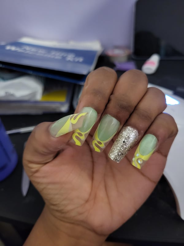 Picture by MelaninLae saying 'Why Are My Nails Glowing'