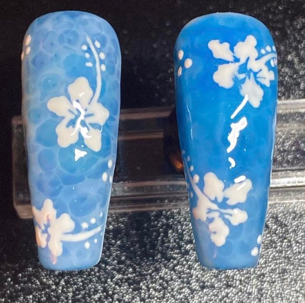 Picture by saddgasm saying 'Which Nail Has A Better Water Background?'