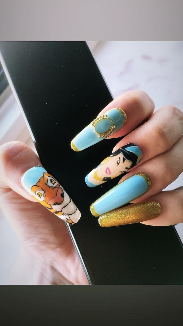 Picture by JustSomeFruitt saying 'Trying To Improve My Nail Art 🐅 Jasmine And Rajah'