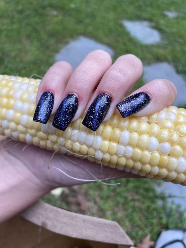 Picture by StrangeMango775 showing 'Did My Sisters Cat Eye Nails, Swipe For Corn Husk Modeling 😂' number 2