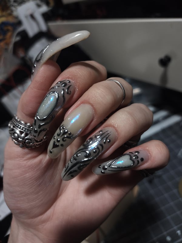 Picture by ninjagobabe2001 saying 'Ornamental Moonstone Nails🤍🩵'