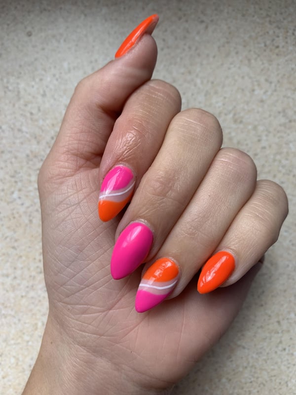 Picture by lnelles saying 'Summer Vacation Nails 🩷🧡'