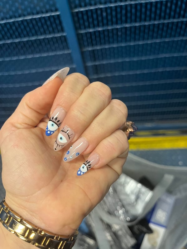 Picture by IamToddDebeikis saying 'Evil Eye Nails'