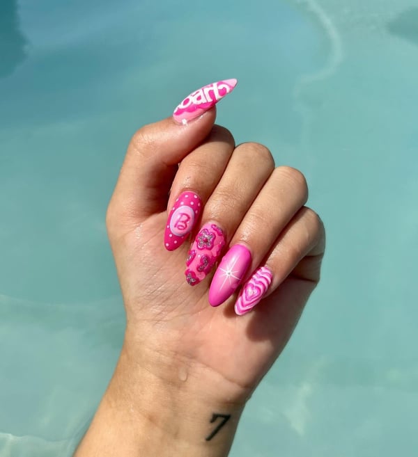 Picture by dylanadomynails saying 'Here’s A Handpainted Barbenheimer Set I Did 🖤💖 | @dylana.do.my.nails'