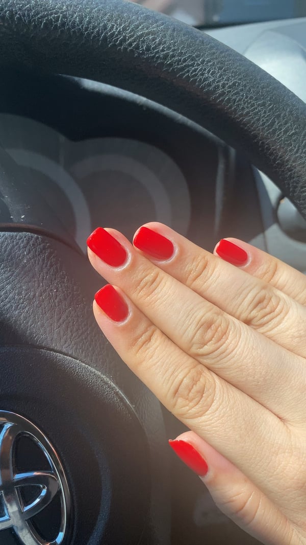 Picture by heyitsroxanne saying 'Testing Out The Red Nail Theory 🍒❤️'