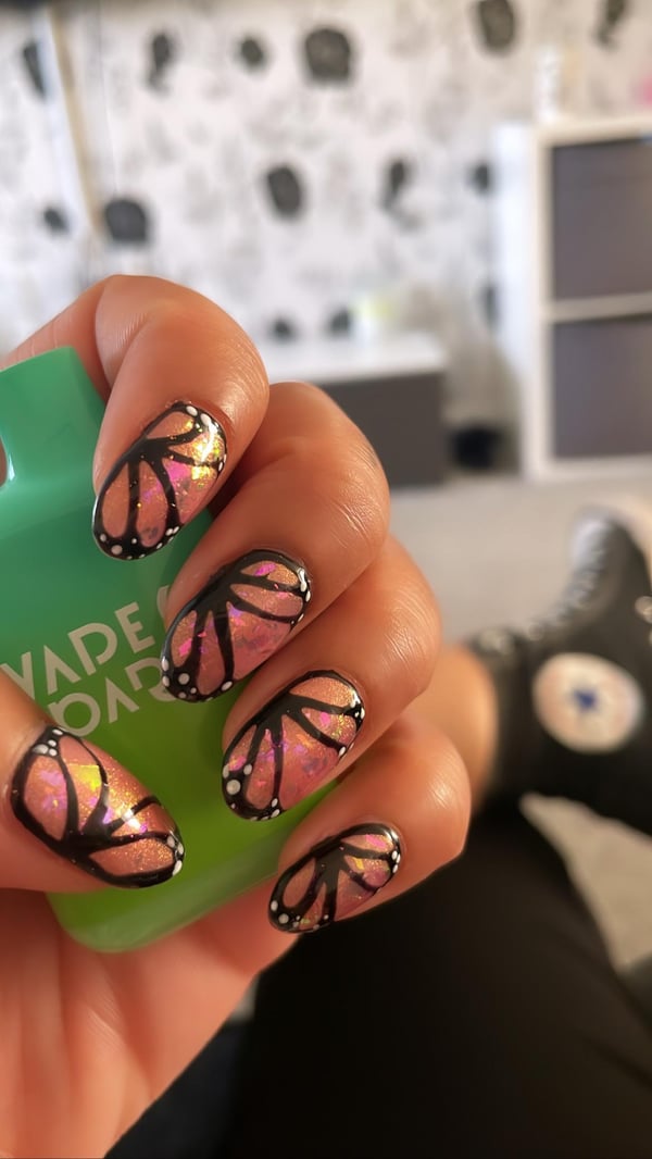 Picture by mysticpanda_xx saying 'Nail Tech Did This Butterfly Wing Pattern For Me As I Was Too Indecisive - Giving Fairycore🦋 🧚‍♀️ 🍄'