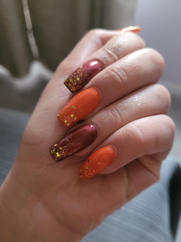 Picture by Ok-GetitBish-9653 saying 'Sparkly Fall Nails 🎃'