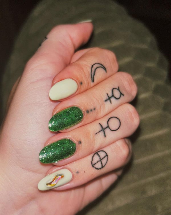 Picture by kelseymh saying 'Simple But Cute Green Gel On My Natural Nails With A Little Iridescent Decal! Done By Bri At The Color Bar In Gardner, MA'