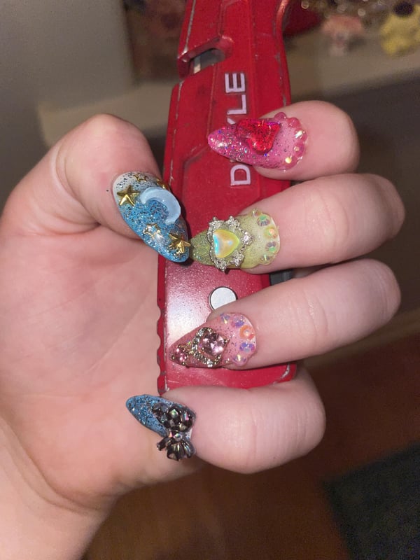 Picture by wowyfandoms saying 'I Know Some Ppl Think Nails Like This Are Tacky But I Literally Can’t Stop Myself From Going All Out'