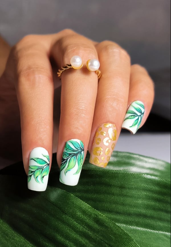 Picture by benigNails saying 'Hand Painted 🌿🐆'