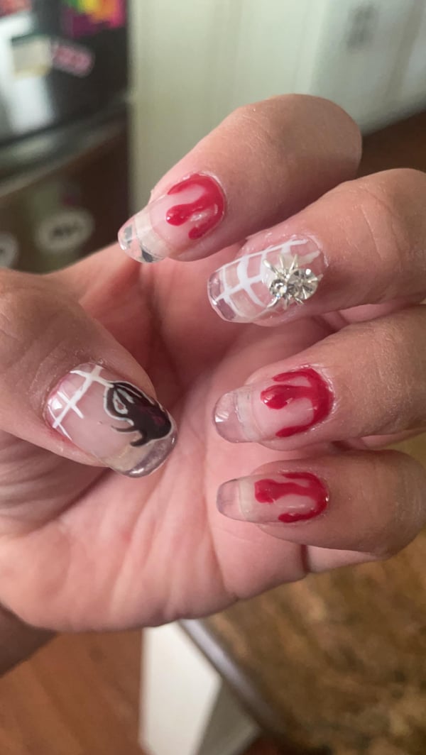 Picture by TokkiSButt saying 'Practicing Halloween Nail Art'