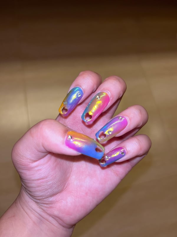 Picture by smolsmolazn saying 'Rainbow Nails With Hallow Heart Extensions 🌈'