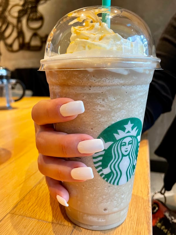 Picture by MyNailsFetish saying 'Caramel Frappuccino And White Nails 😍'